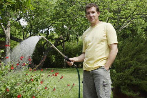 Professional garden clearance work removing branches and debris